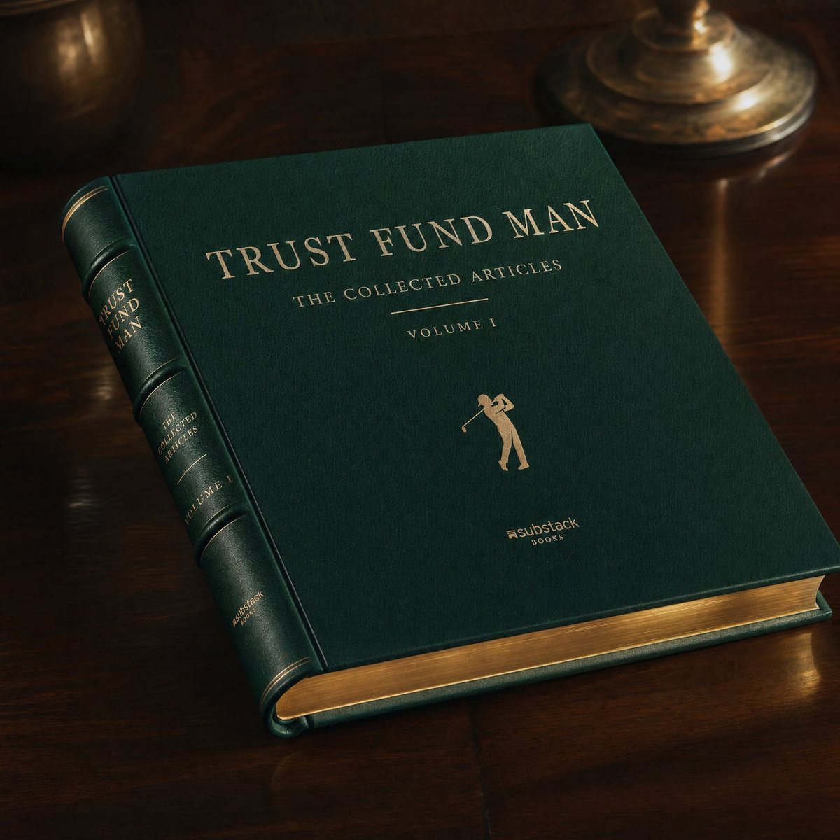 A green leather book stamped in gold: Trust Fund Man, The Collected Articles, Volume I